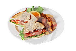 Bacon lettuce tomato sandwich isolated on white with home fries