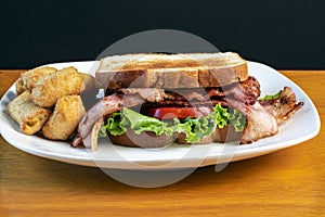 bacon lettuce tomato sandwich with veggie tots