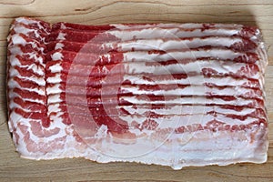 Bacon slice on wooden board