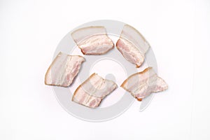 Bacon sliced on white background. pork fat with veins.