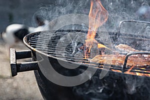 A bacon steak being prepared on the bbq