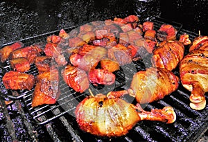 Bacon Wrapped Chicken Drumbsticks and Burnt Ends on the Grill