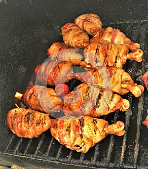 Bacon Wrapped Chicken Drumbsticks and Burnt Ends on the Grill