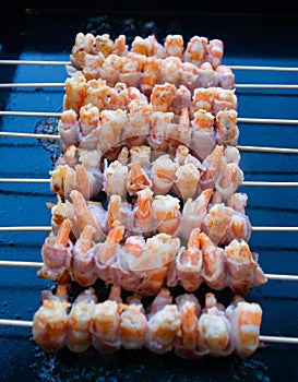 Bacon wrapped shrimp on grill