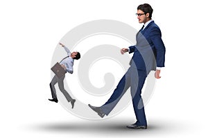 The bad angry boss kicking employee in business concept