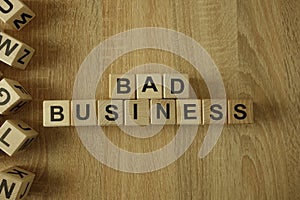 Bad business text from wooden blocks