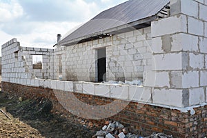 Bad construction destroys a house wall, consruction defects from autoclaved aerated concrete blocks, brick wall failure. Poorly