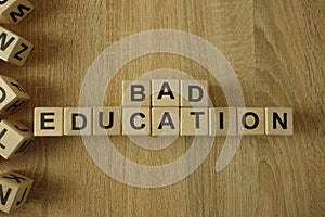 Bad education text from wooden blocks