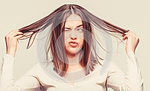 Bad hairs day. Frustrated woman having a bad hair. Woman having a bad hair, her hair is messy and tangled