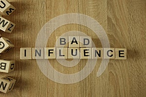 Bad influence text from wooden blocks