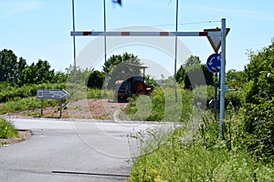 Bad Kreuznach, Germany - 06 14 2021: traffic circle with an old piece of road building machinery