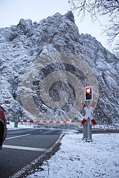 Snow on hill in Rotenfels behind railroad crossing