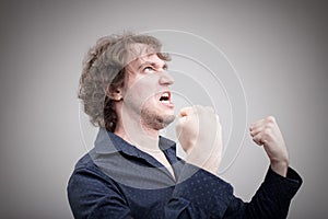 Bad man expressing anger with face and hands