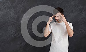 Stressed man whit bad memory trying to concentrate photo
