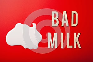 Bad milk word letter text lactose intolerance allergy. milk splatter. avoid dangerous dairy