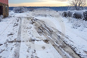 Bad muddy winter road. Beautiful winter landscape. Bad rural winter road