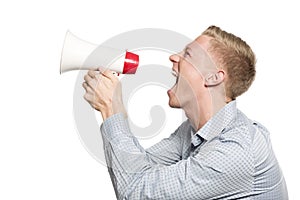 Furious businessman shouting with megaphone.