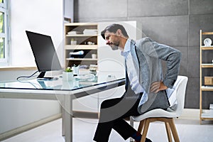 Bad Posture Sitting In Office With Backache