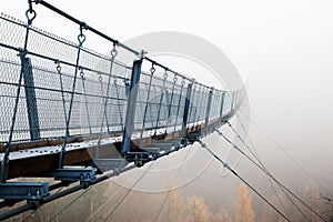 Bad prospects - suspension bridge in the fog photo