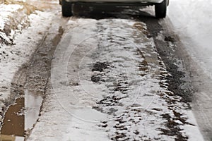 Bad road with snow and mud