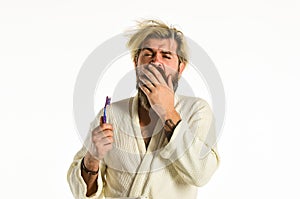 Bad smell. Keep teeth healthy. Healthy habits. Brush teeth. Morning routine. Oral hygiene. Man in bathrobe hold