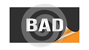 BAD text written on black orange sticker