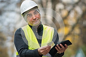 Bad times: poor construction worker and his empty wallet