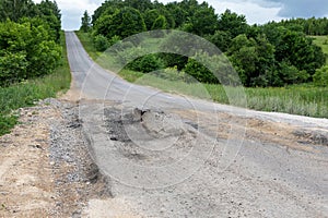 Bad track with potholes and faults. Emergency road photo