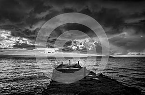 Bad weather above the Yumani dock at Lake Titicaca black and white