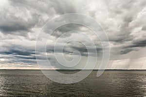 Bad weather with clouds and rain on a lake in Masuria, Poland