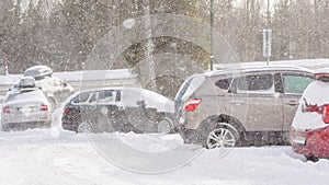 Extreme snowfall with cars coverd with a lot of snow in Europe, Slovakia, mountain district