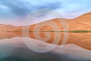 Badain Jaran Desert with lake and reflection