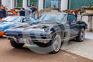 BADEN BADEN, GERMANY - JULY 2019: black CHEVROLET CORVETTE C2 CONVERTIBLE CABRIO 1962, oldtimer meeting in Kurpark