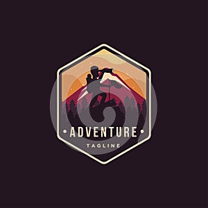 Badge emblem Man on the peak Nature outdoor adventure logo vector illustration