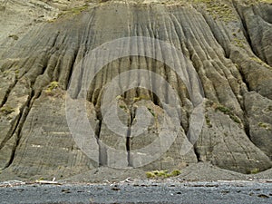 Badland erosion of soft conglomerate sediment photo