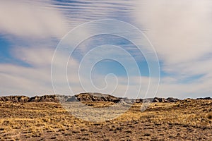 Badlands Formations Under Thin Clouds