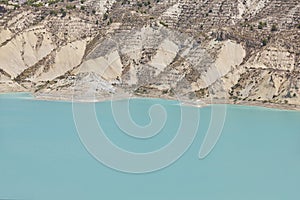 Badlands landscape and blue waters in Algeciras reservoir. Spain