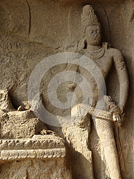 Badly damaged carving of a Bodhisattva at the entrance of Cave 2, Aurangabad Caves Western Group, Maharastra, India