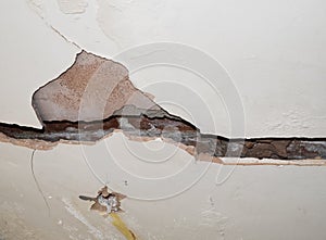 Badly damaged interior plasterboard wall