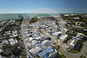 Badly damaged mobile homes after hurricane Ian on Manasota beach in Florida residential area. Consequences of natural