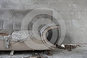 A badly damaged sofa with copy space