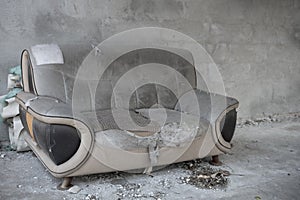 A badly damaged sofa with copy space