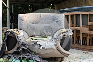 Badly damaged sofa in the outdoor at horizontal composition