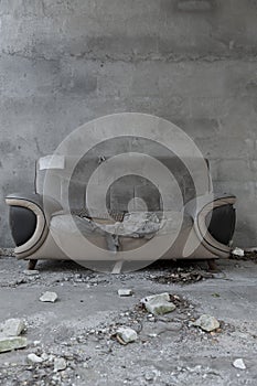 A badly damaged sofa at vertical composition