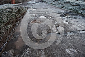 Badly Potholed Road Iced Over