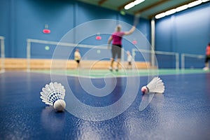 Badminton - badminton courts with players competing