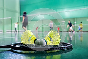 Badminton courts with players competing