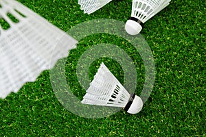 Badminton game shuttlecocks on grass background close up