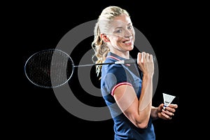 Badminton player holding racket and shuttlecock