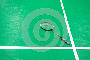 badminton racket on green court